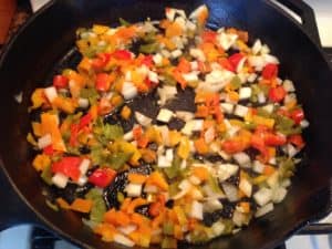 Sauteing peppers and onions in cast iron skillet
