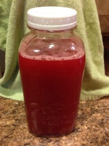 The raspberry rhubarb shrub - done and in its half-gallon mason jar