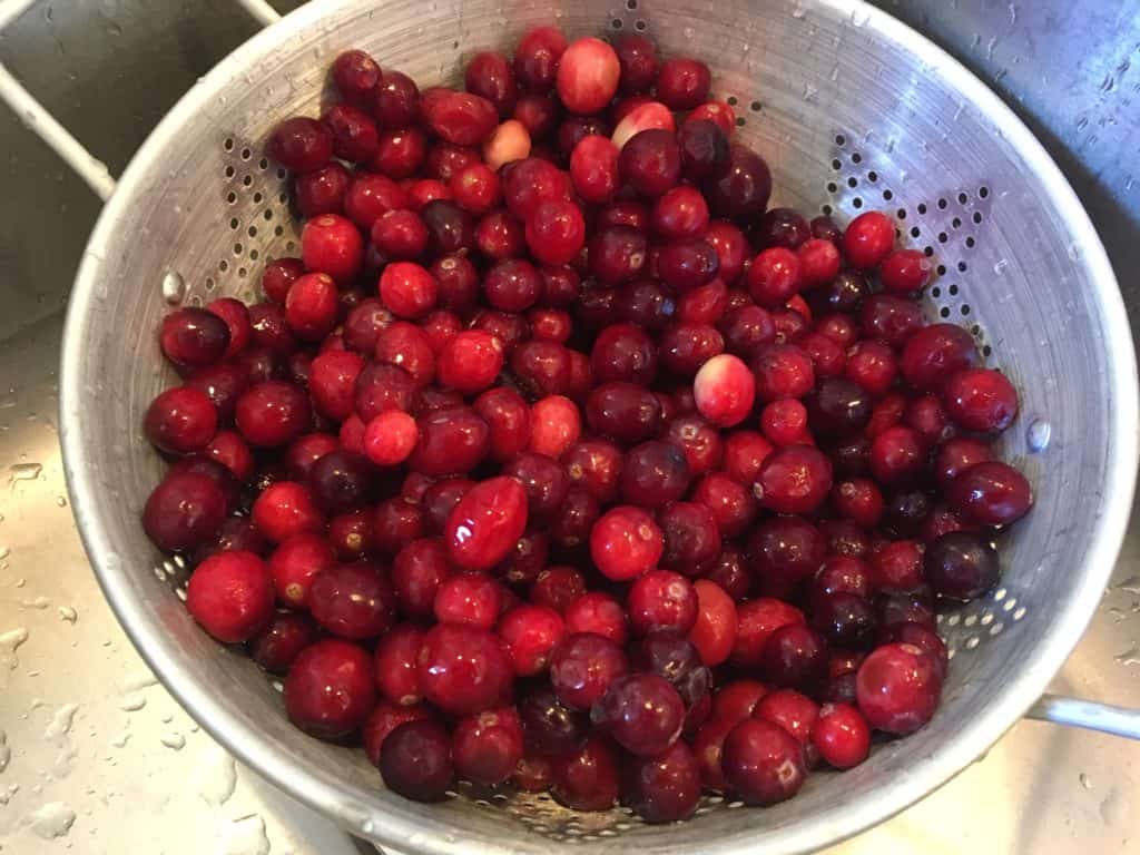 Washing the cranberries for cranberry mustard
