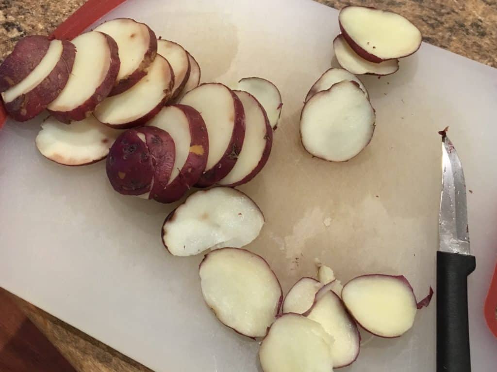 Slicing the potatoes before frying them
