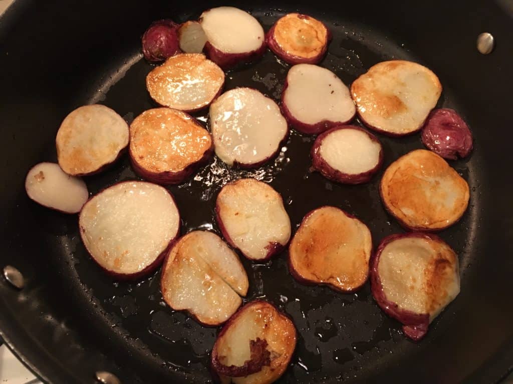 Frying the sliced potatoes for Loaded Potato Nachos