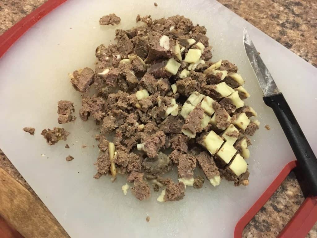 The leftover cheeseburgers getting chopped for Loaded Potato Nachos
