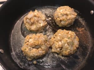 Shrimp Burgers going down in the hot pan