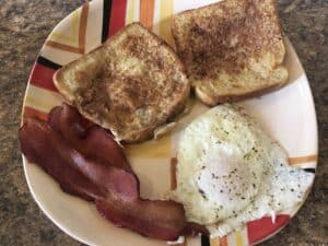 French toast with fried egg and bacon