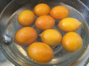 Meyer lemons soaking in baking soda bath