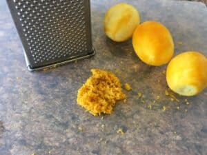 Zest of lemons with box grater