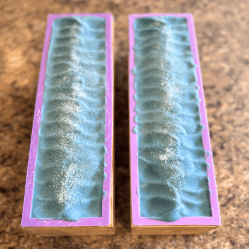 Process photo showing two loaves of freshly poured Salty Sailor goat's milk soap