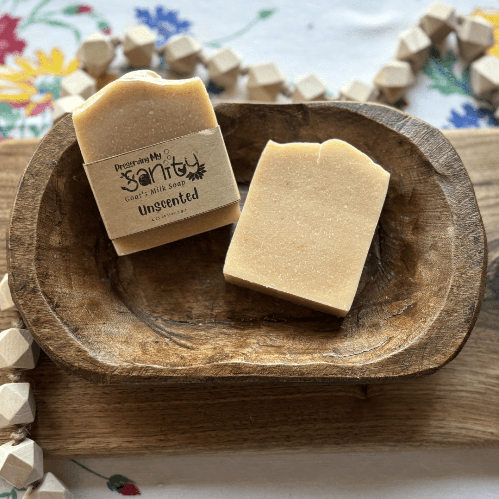 Flatlay photo showing two bars of plain unscented goat's milk soap