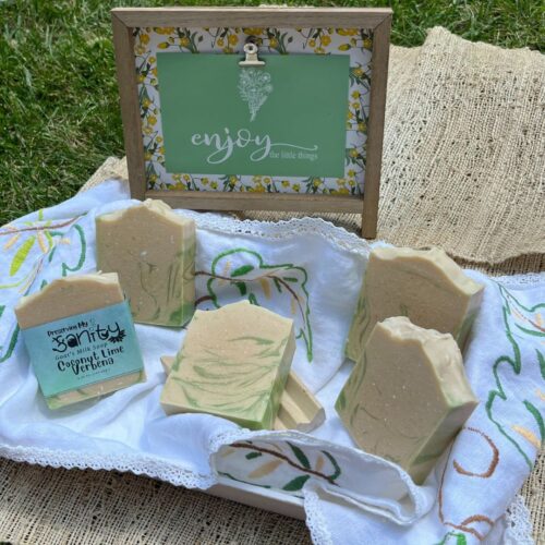 Exterior collage photo of some bars of coconut lime verbena soap and a made in the US wooden soap holder