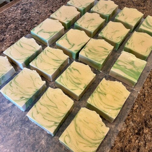 Interior flatlay photo of some pretty bars of coconut lime verbena soap just after cutting in my Minnesota kitchen