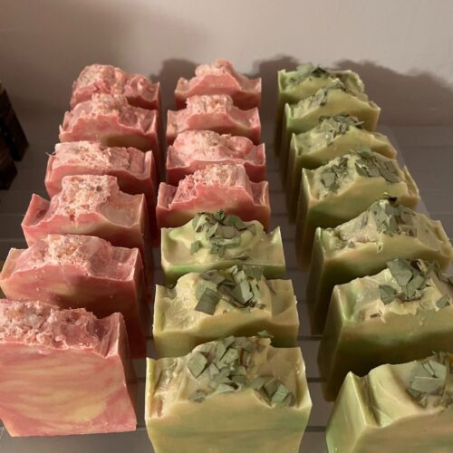 Interior photo of rows of two kinds of custom soap that were made to give as wedding favors for a small spring wedding