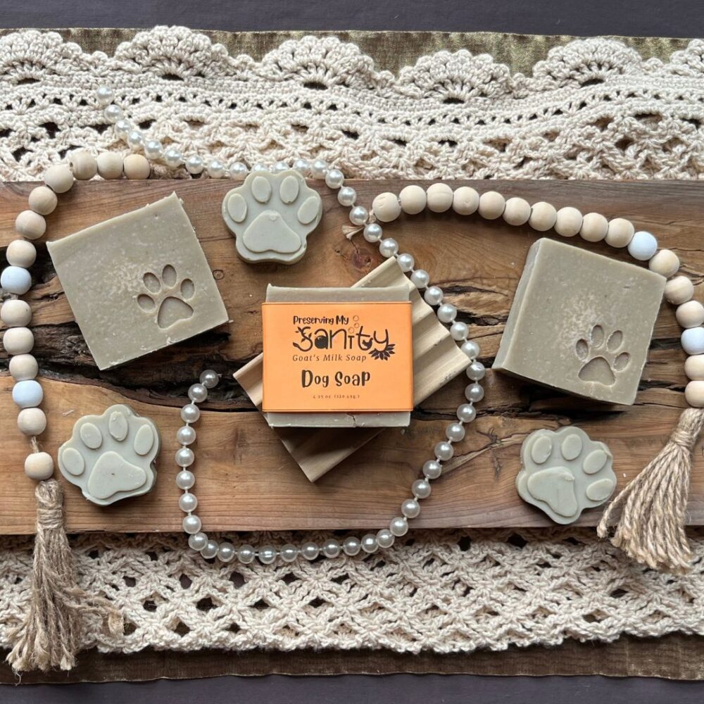 Pretty interior flatlay of dog soap with a background of crochet, wooden beads, and pearls