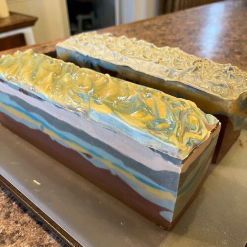 Alternative view of two loaves of mountain sky soap in my Minnesota kitchen prior to cutting them into bars