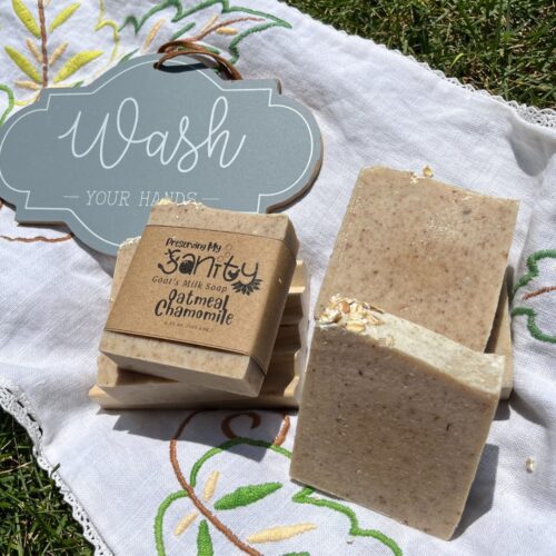 Exterior collage photo of some oatmeal chamomile soap on a vintage embroidered doily in the sunshine