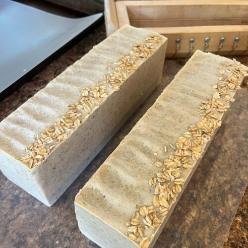 Two loaves of oatmeal chamomile soap taken out of the molds but shown here before cutting into bars.