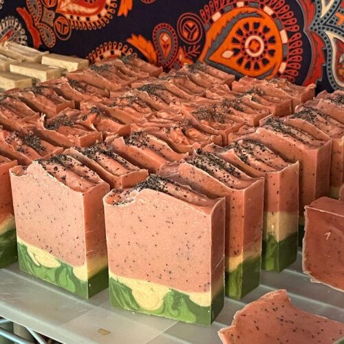 Interior photo of rows of watermelon soap on the curing rack