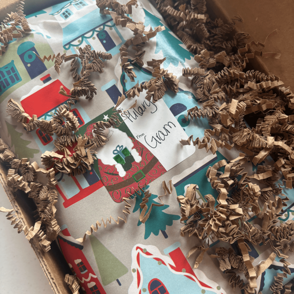 Photo of a special goat milk soap gift wrapped with a gift tag on it and ready for gifting.