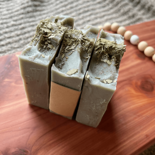 Side and top view of three bars of Eucalyptus Mint soap on a cedar bath board