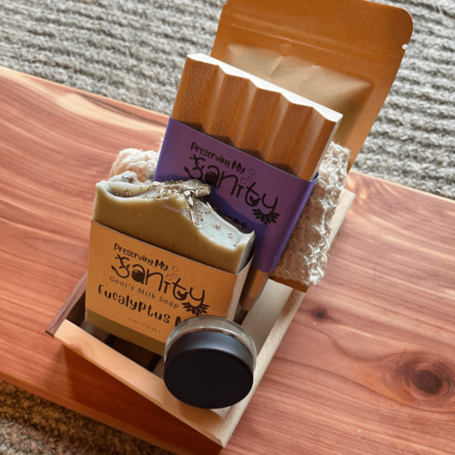 Alternate view of the get well bundle, featuring eucalyptus mint essential oil soap, eucalyptus bath salt, untinted mango lip butter, a soap dish, sisal soap bag, and reclaimed wood gift tray