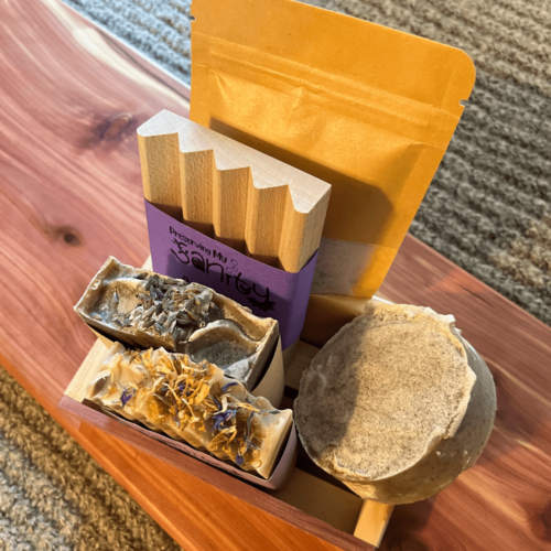 Alternate view of the lavender lovers bundle that includes a lavender bath salt, lavender soap, lavender luffa soap, lavender orange soap, a wood soap dish, and a reclaimed wood gift tray