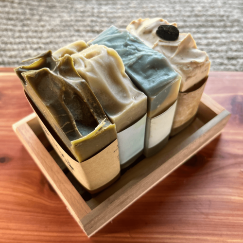 Alternate view of reclaimed wood tray for creating your own gift set, pictured with four bars of handcrafted goat's milk soap inside (not included) sitting on a cedar board