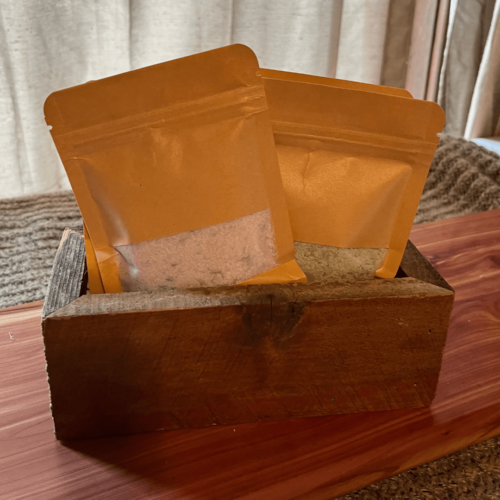Alternate view of the salt bundle that includes four kinds of bath salt, a reusable cheesecloth bag, and a reclaimed wood trough