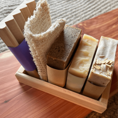 Alternate view of the unscented bundle that includes three bars of soap, a wood soap dish, sisal soap saver bag, and reclaimed wood gift tray