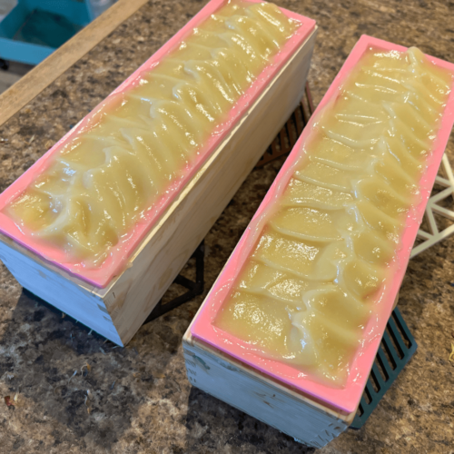 Photo showing two loaves of freshly poured Soothing Yogurt and Oatmeal goat's milk soap