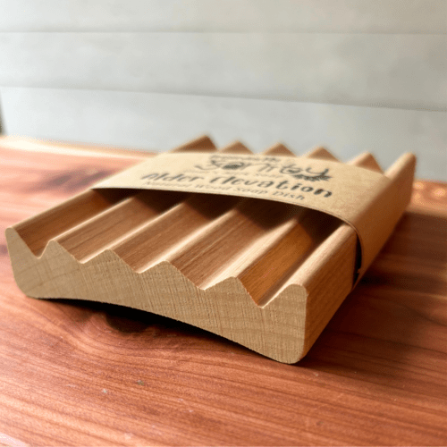 Simple side view photo showing an alder elevation-style natural wood soap dish made in the USA