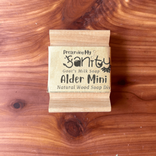 Overhead flatlay photo showing an alder mini natural wood soap dish made in the USA