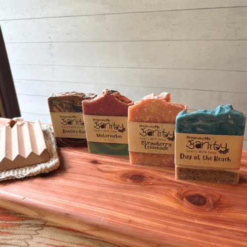 Alternate view of summer soap sampler featuring four half-size bars of soap, a sisal soap saver bag, and a natural wood soap dish.