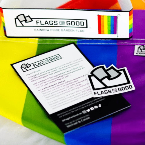 Alternate view of rainbow pride garden flag folded up with branded packaging