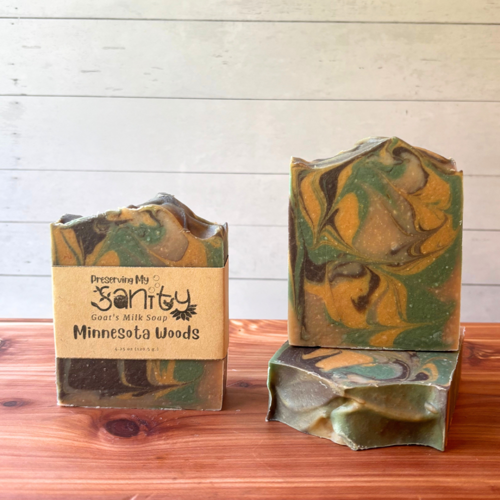 Display photo showcasing one of my bestselling soaps, Minnesota Woods. This is a pretty four color swirl soap featuring dark brown, light brown, yellow, and green - just like the actual Minnesota woods! Handcrafted in small batches with local goat milk.