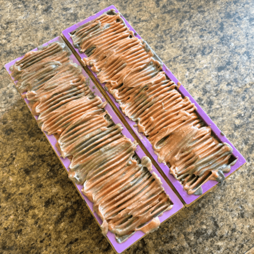 Process photo showing two freshly poured loaves of Warm Flannel goat milk soap, handcrafted in Minnesota with local goat milk.