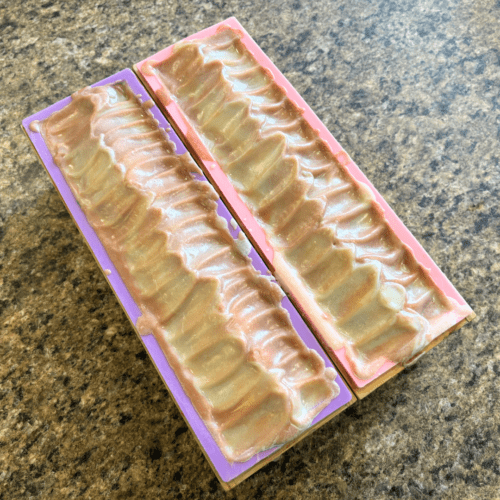 Process photo showing two loaves of freshly poured Warm Vanilla Sugar goat milk soap with textured tops, as part of the fall collection.