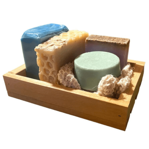 Alder reclaimed wood gift tray with a few bars of soap and a soap saver bag.