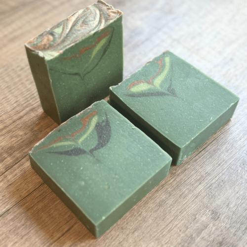 Alternatei view display photo showcasing three bars of Forest Berries goat milk soap, part of the holiday collection