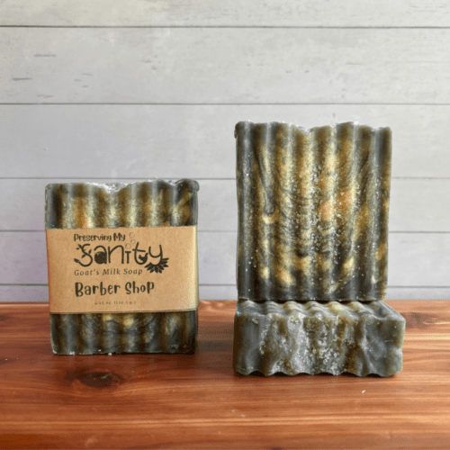 Photo of three bars of Barber Shop goat milk soap arranged to show different angles and parts of handcrafted soap bars