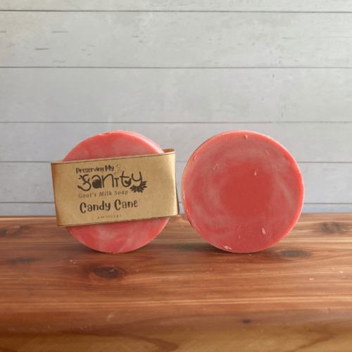 Photo of two round bars of Candy Cane goat milk soap arranged to show different angles and parts of handcrafted soap bars