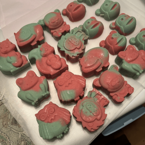 Process photo showing cotton candy animal-shaped soaps freshly removed from silicon molds