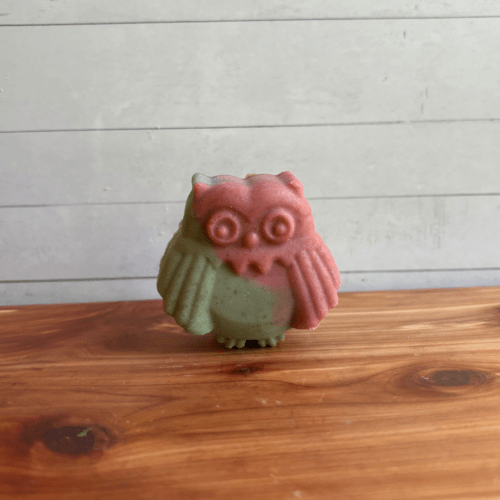 Photo of an owl animal-shaped soap in Cotton Candy scent, handcrafted goat milk soap in a fun blue and pink design.