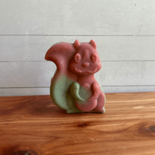 Photo of a squirrel animal-shaped soap in Cotton Candy scent, handcrafted goat milk soap in a fun blue and pink design.