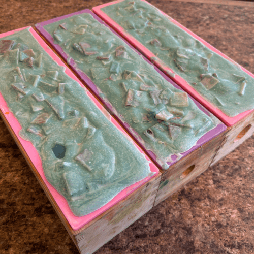 Process photo showing three freshly poured loaves of Sea Glass goat milk soap