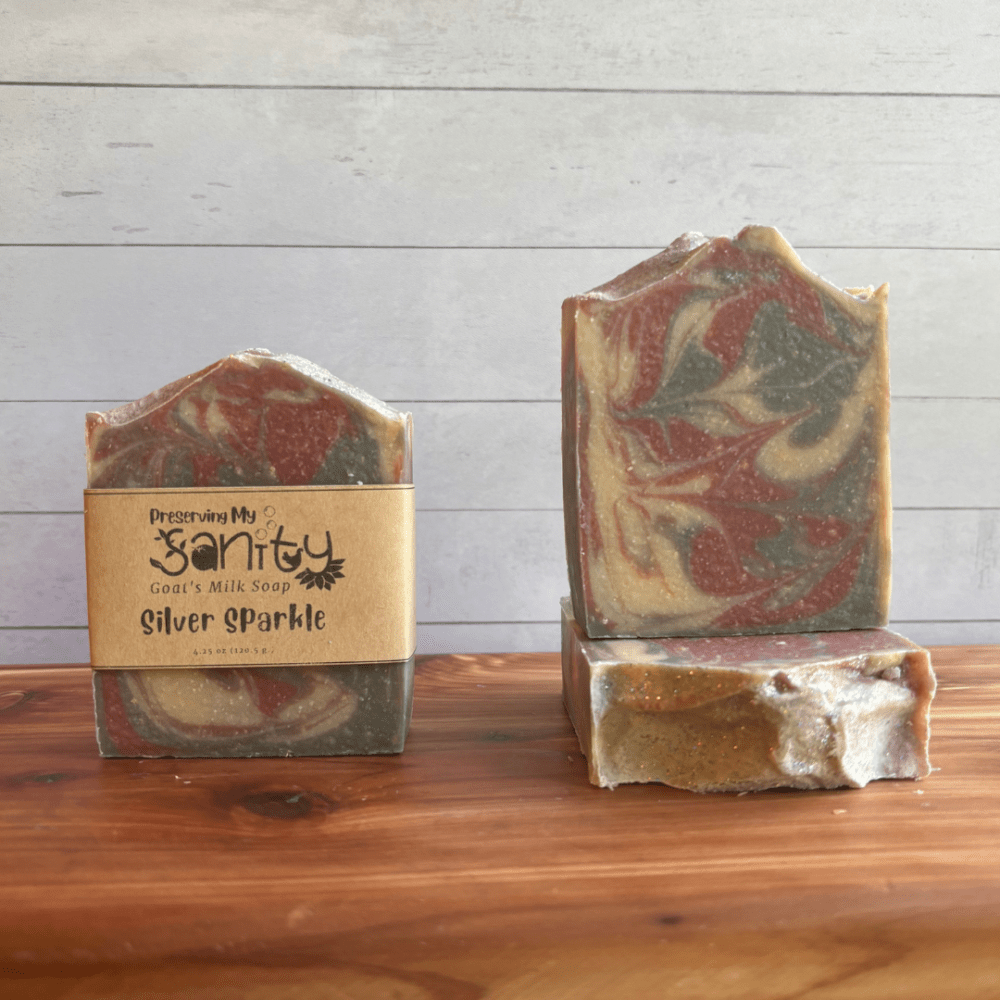 Photo of three bars of Silver Sparkle goat milk soap arranged to show different angles and parts of handcrafted soap bars