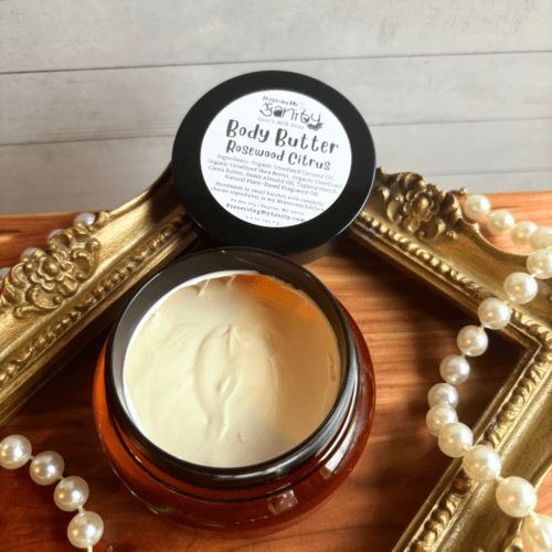 Plastic container of Rosewood Citrus Body Butter made with shea butter, cocoa butter, natural fragrance oil and more