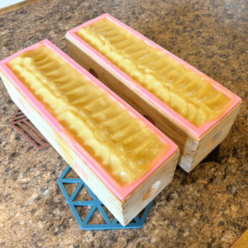 Photo of two loaves of oatmeal and yogurt goat milk soap, which looks similar to what breast milk soap would look like