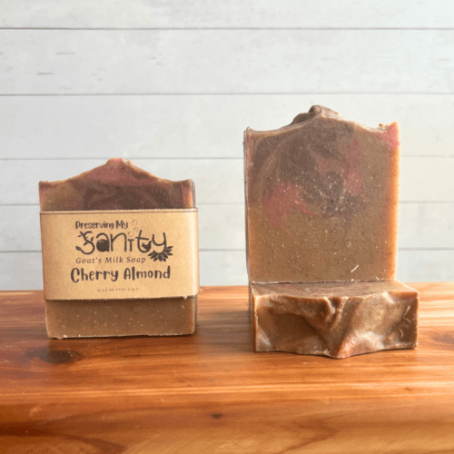 Front view display photo of three bars of Cherry Almond goat milk soap