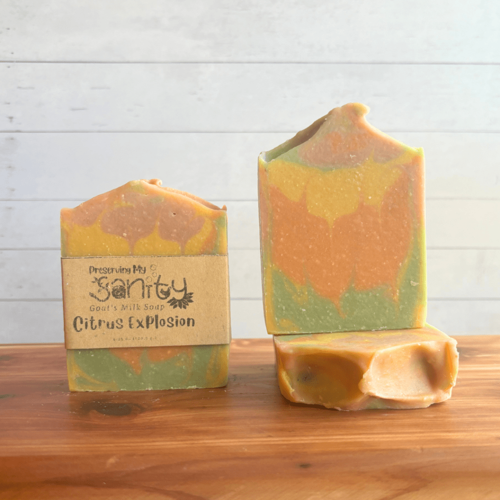 Front view photo of three bars of Citrus Explosion goat milk soap