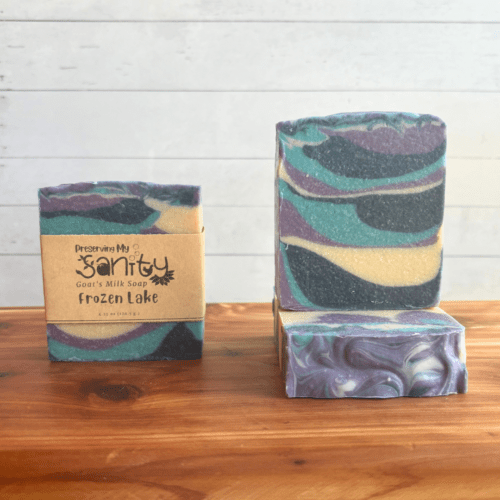 Front view photo showcasing three bars of Frozen Lake goat milk soap