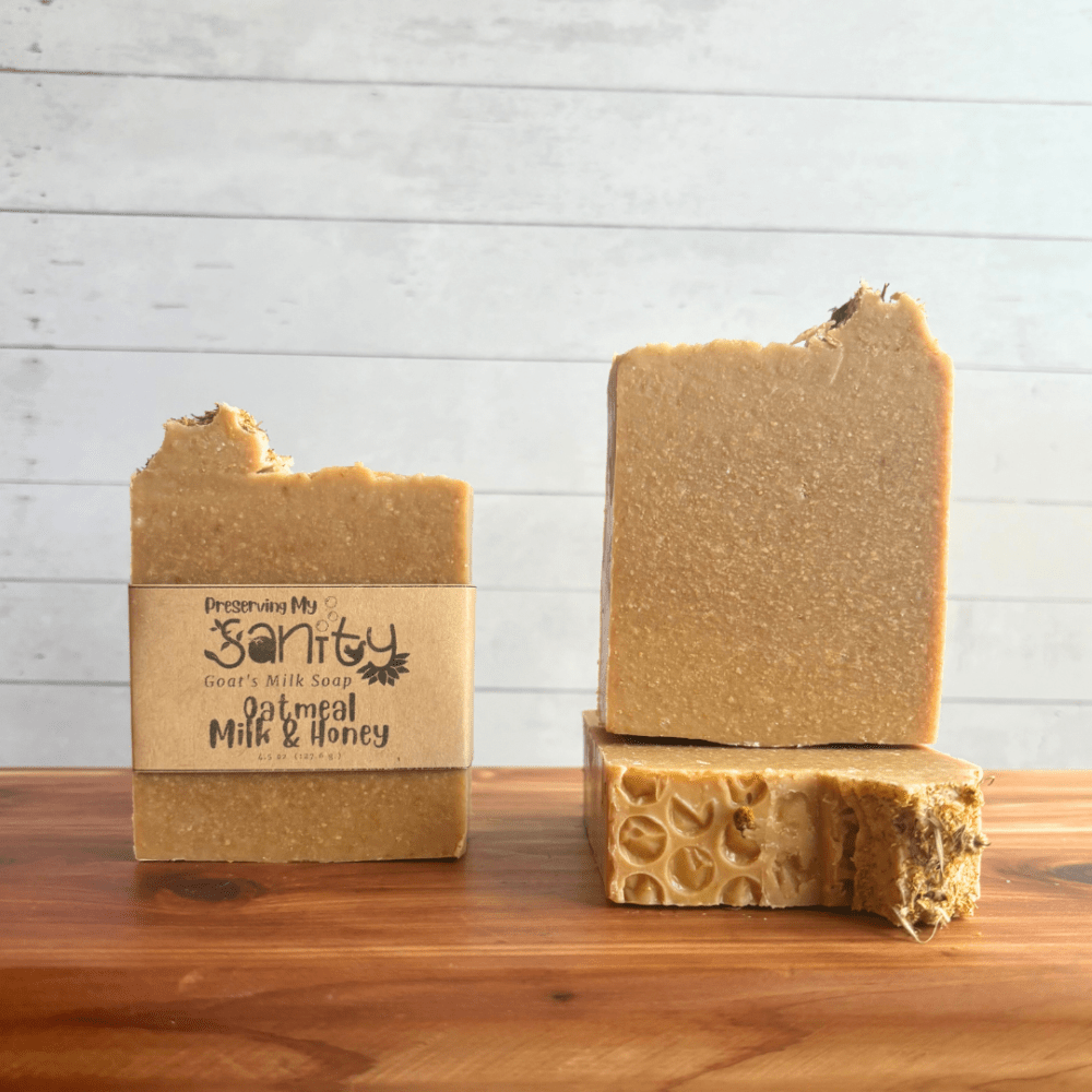 Front view display photo showcasing three bars of Oatmeal Milk and Honey goat milk soap